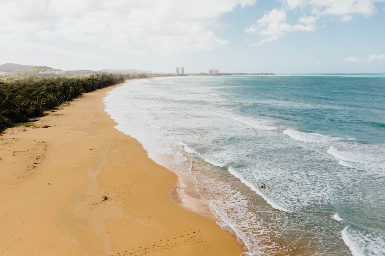 Food kiosks at Luquillo Beach, Puerto Rico, with fried snacks and cold beer