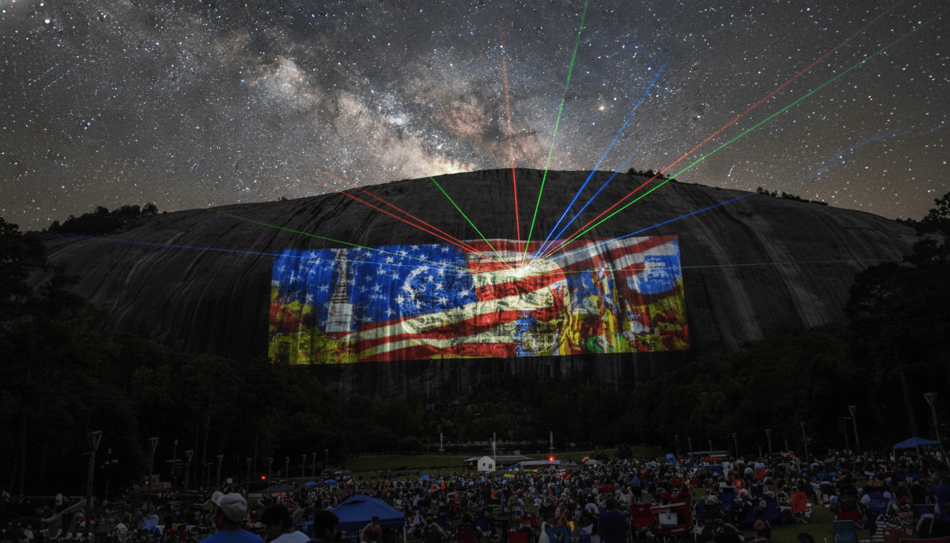 Stone Mountain laser show at night — colorful projections on the granite face with crowd on the lawn